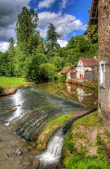 Fototapeta na wymiar Waterfall in the Village of Segur-le-Chateau, France