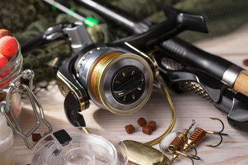 fishing tackle on a wooden table.