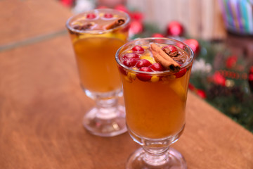 Tasty aromatic mulled wine on wooden table