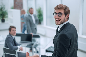 close up. successful young businessman standing in the office
