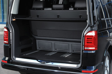 Modern car with open empty trunk outdoors