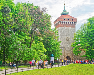 Krakow, Poland - May 1, 2014: People at Saint Florian Gate in the old town of Krakow, Poland