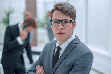Fototapeta premium successful business man standing in a modern office.