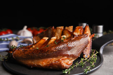 Delicious roasted ribs served on plate, closeup