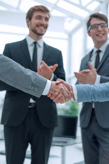 close up. business partners, confidently shaking hands