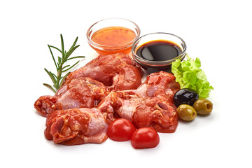 Raw chicken legs in a barbecue marinade, isolated on white background