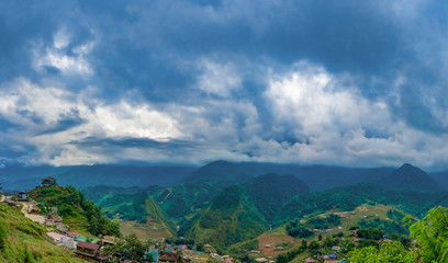 Fototapeta na wymiar Big panorama. scenery of Cat Cat village, popular tourist trekking destination. Rice field terraces. Mountain view in the clouds. Sapa, Lao Cai Province, north-west Vietnam.