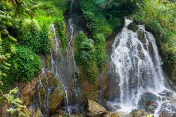 Fototapeta na wymiar Silver waterfall at Cat Cat Village in Sapa Sapa Vietnam Indochina Asia. Waterfall landscape.