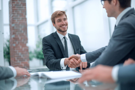 business partners greet each other at a business meeting.
