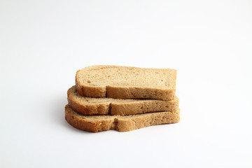 Isolate of white loaf of bread with sliced ​​pieces on a white background