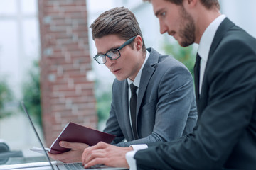 business colleagues working with documents in a modern office