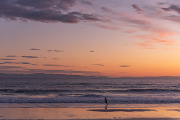 Child Running on the Beach in California at Sunset