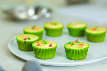 Plate with freshly baked sweet muffins. Sweet pastries, recipes, cooking