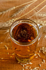 Bretzels and beer on wooden background. Oktoberfest food