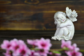Guardian angel on wooden background
