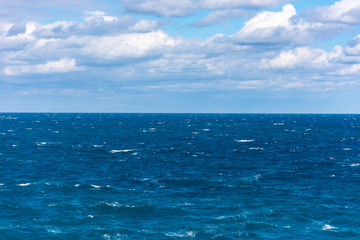 View of a rough sea with blue sky