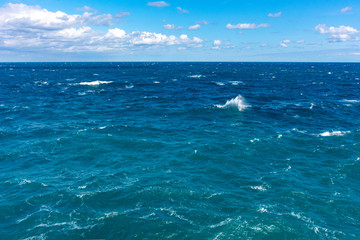 View of a rough sea with blue sky