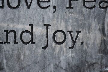 A Plaque With Written Words Joy