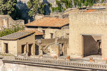 Fototapeta na wymiar Naples, Herculaneum, archaeological area, view of the remains of the ancient city buried by the eruption of the Vesuvius volcano in 79. View of the houses.