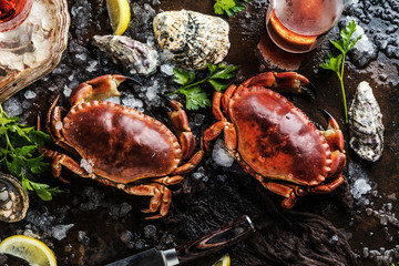 Assortment of seafood with raw fresh octopus gourmet dinner background, oysters and with red edible crab