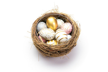 Naklejka na ściany i meble Happy Easter eggs white background. Golden shine decorated eggs in basket, for greeting card, promotion, poster
