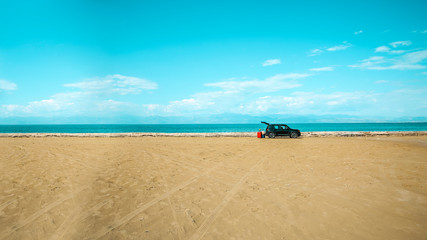 Obraz na płótnie Canvas Summer car on beach and free space for your decoration 