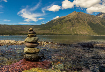 Cairn on the shores of a mountain lake