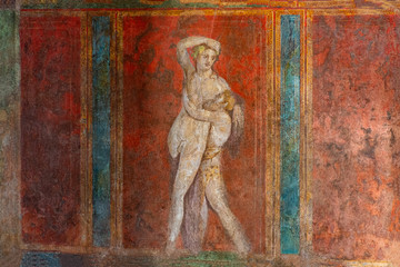 Italy, Pompeii, archaeological area, remains of the city buried by the eruption of ashes and rocks of Vesuvius in 79. Remains of the frescoes in the Villa of Mysteries