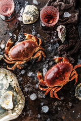 Assortment of seafood with raw fresh octopus gourmet dinner background, oysters and with red edible crab