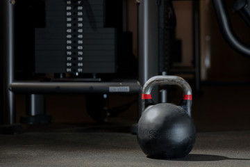  large black kettlebell in a sports hall
