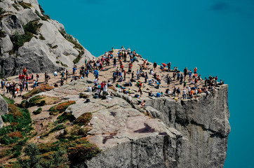 Overcrowded  edge of the cliff Preikestolen in Norway. A tourist attraction in the municipality of Strand in Rogaland.