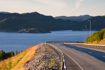 Road towards the north of Norway. Landscape view at sunset.