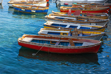 Fototapeta na wymiar Italy, Naples, view of old boats in the port of Santa Lucia