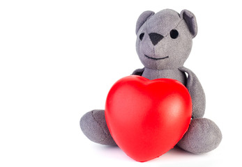 Teddy bear with red heart.