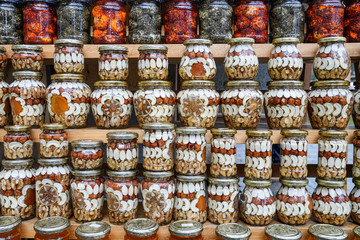 Close up of the glass jars with honey dipped nuts