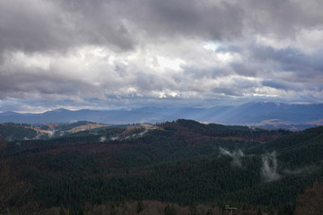 Amazing view, landscape, beautiful mountains with forest in fog