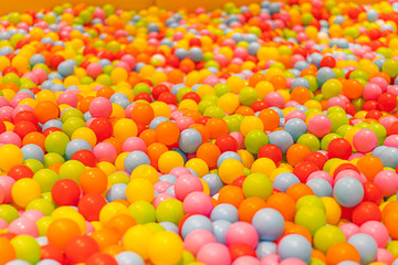 Colorful play balls pool in a kid playing area.
