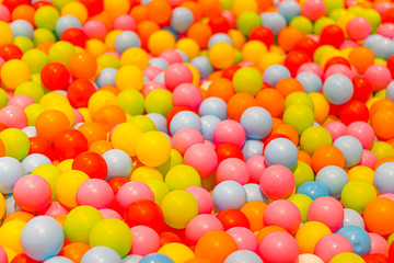 Colorful play balls pool in a kid playing area.