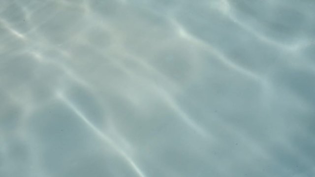 the surface texture of the swimming pool in blue Tosca perfect for background