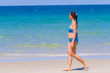 Woman happy with bikini blue on beach at Ban Krut