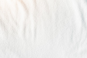 White towel texture for background. That fabric or textile consist of cotton fiber material. Look plush, fluffy, dry, soft and clean. For background about baby, spa, hotel, laundry and hygiene etc.