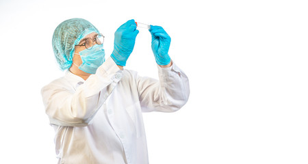 lab technician looks at a test tube of clear liquid, coronavirus