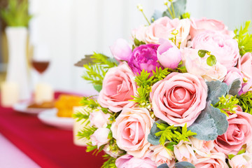 Valentine's day concept,bouquet of red and pink roses Put on the table food lunch In a restaurant background