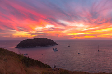 stunning sunset above Man island in front of Promthep cape and wind turbine viewpoint. .Promthep cape and wind turbine viewpoint are popular landmark in Phuket .