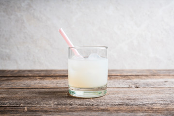 Old fahioned lychee cocktail on the rustic background. Selective focus. Shallow depth of field.