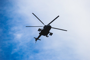 Russian military helicopter during flight in the air, a squadron formation of helicopters