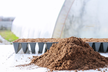 Pile of humus soil on a white background.