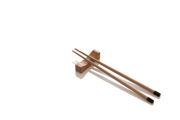 Wooden pairs of chopsticks on white background. cooking culture in Asian countries.