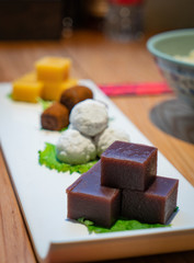 Beijing traditional pastry, such as yellow Pea jelly, Rolling donkey (glutinous rice rolls with sweet bean flour), Steamed rice cakes with sweet stuffing, Kidney Bean Roll on the table, China