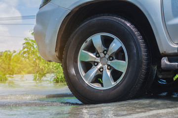 Cose-up of pickup truck on a flooded street. © EsanIndyStudios